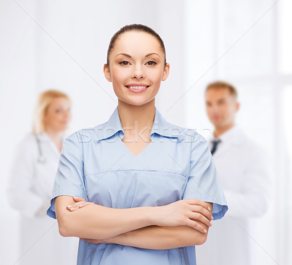 smiling female doctor or nurse Stock photo © dolgachov