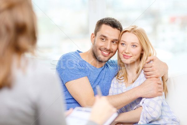 young couple hugging at psychologist office Stock photo © dolgachov
