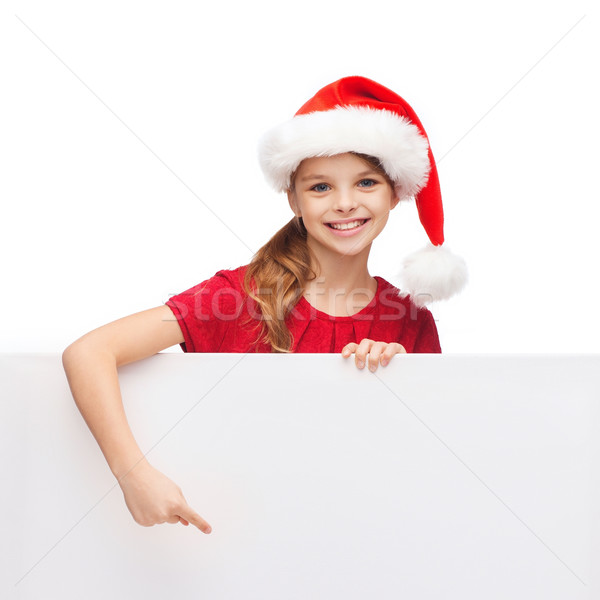 child in santa helper hat with blank white board Stock photo © dolgachov