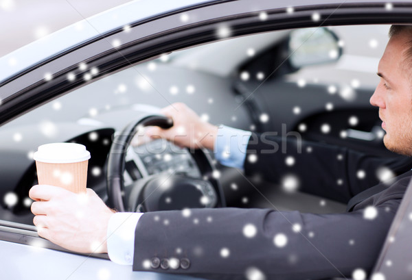 close up of man drinking coffee while driving car Stock photo © dolgachov