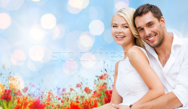 happy couple having fun over poppy flowers field Stock photo © dolgachov