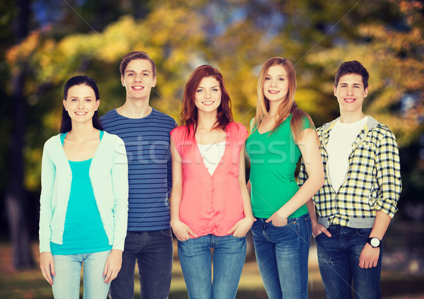 group of smiling students standing Stock photo © dolgachov