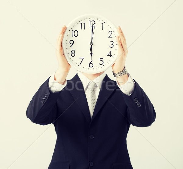 man with wall clock Stock photo © dolgachov