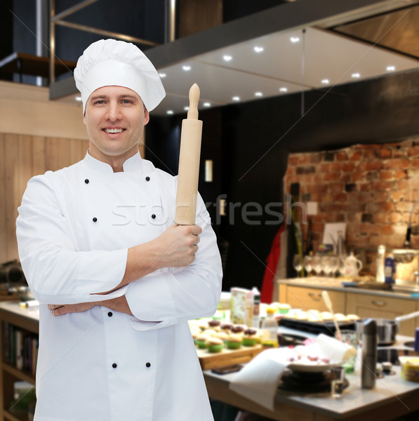 happy male chef cook holding rolling pin Stock photo © dolgachov