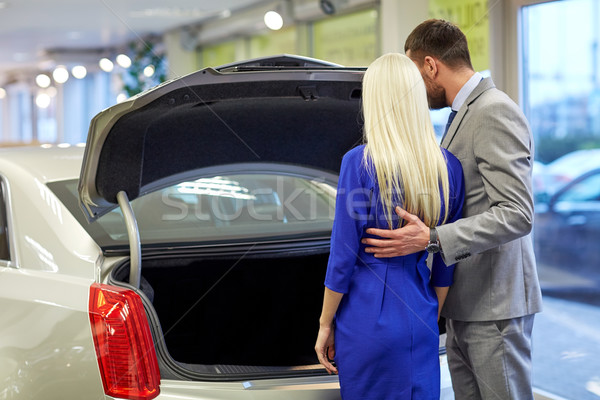 happy couple choosing car in auto show or salon Stock photo © dolgachov