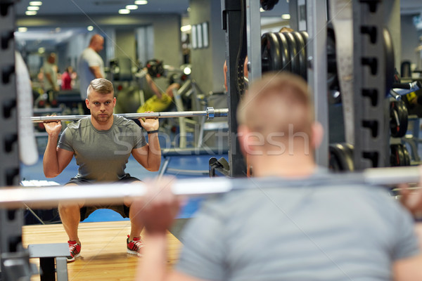 Junger Mann Muskeln Langhantel Fitnessstudio Sport Fitness Stock foto © dolgachov