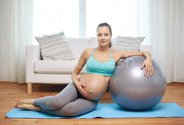 happy pregnant woman with fitball at home Stock photo © dolgachov
