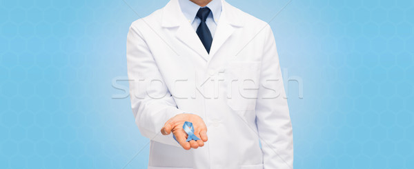 doctor with prostate cancer awareness ribbon Stock photo © dolgachov