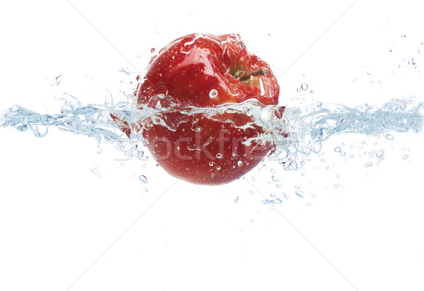 apple falling or dipping in water with splash Stock photo © dolgachov