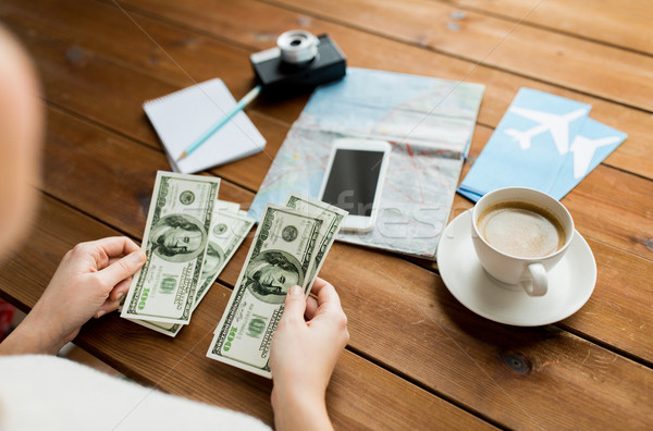 close up of traveler hands counting dollar money Stock photo © dolgachov