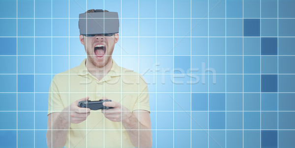 angry man in virtual reality headset with gamepad Stock photo © dolgachov