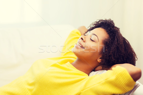 Happy African Young Woman Relaxing At Home Stock Photo C Syda