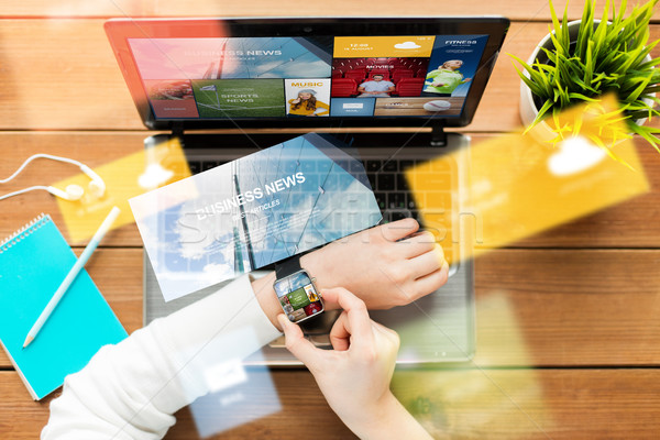 close up of woman with smart watch and laptop Stock photo © dolgachov