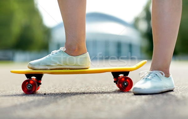 close up of female feet riding short skateboard Stock photo © dolgachov