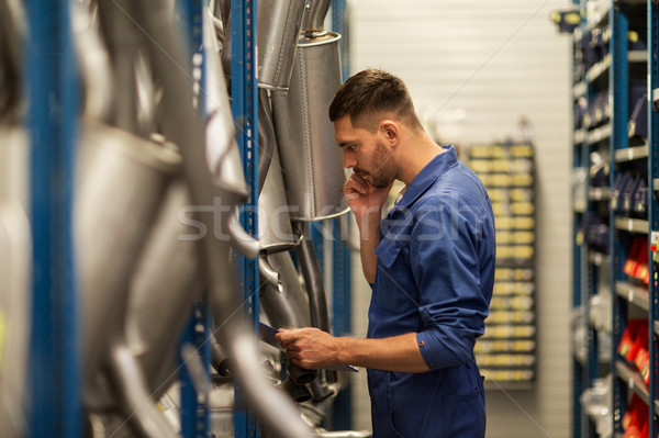 auto mechanic with clipboard at car workshop Stock photo © dolgachov