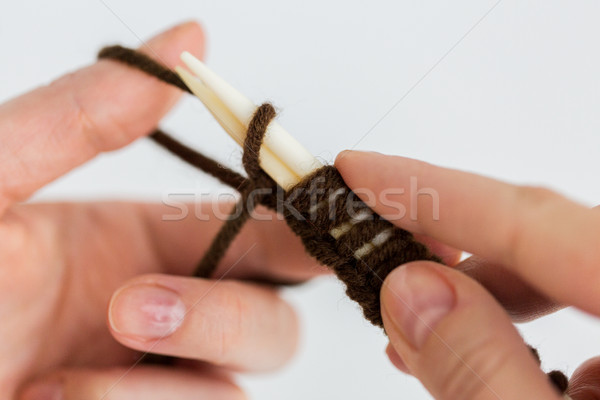 close up of hands knitting with needles and yarn Stock photo © dolgachov