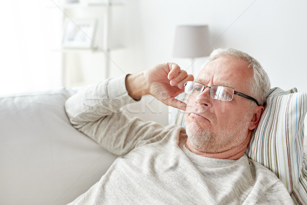 Supérieurs homme verres pense maison [[stock_photo]] © dolgachov