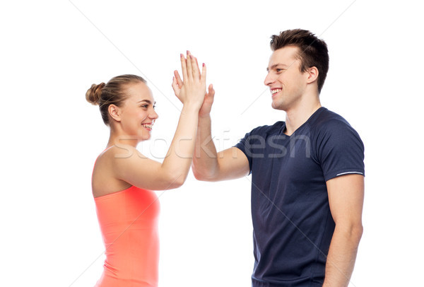 Szczęśliwy człowiek kobieta high five sportu Zdjęcia stock © dolgachov