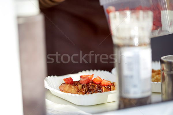 waffle with strawberry on paper plate and fork Stock photo © dolgachov