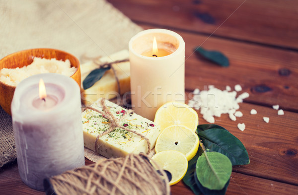 close up of natural soap and candles on wood Stock photo © dolgachov