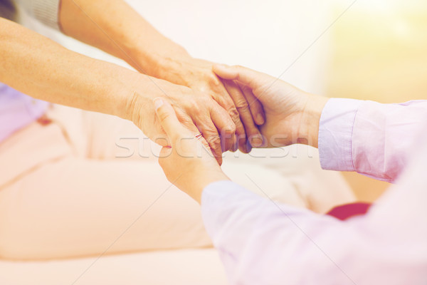 close up of senior and young woman hands Stock photo © dolgachov