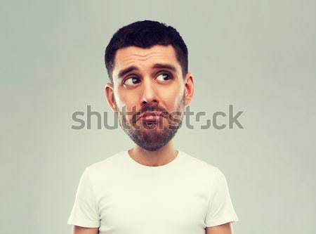 Infeliz moço cinza emoção expressões faciais pessoas Foto stock © dolgachov