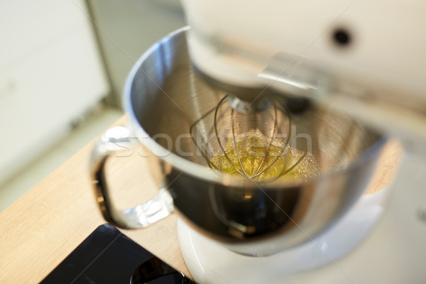 electric mixer whipping egg whites at kitchen Stock photo © dolgachov