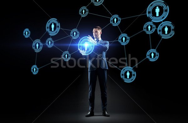 businessman with virtual network contacts Stock photo © dolgachov