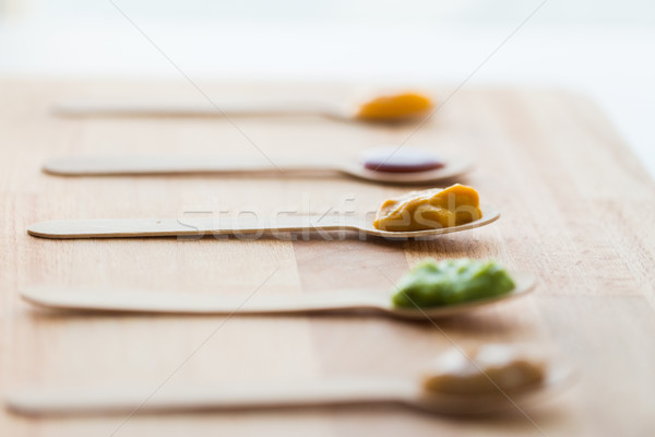 vegetable or fruit puree or baby food in spoons Stock photo © dolgachov