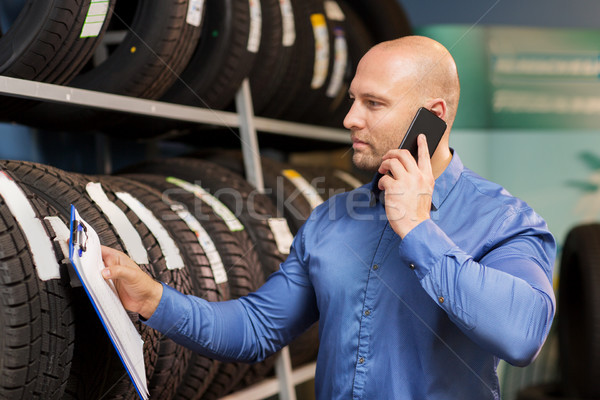 auto business owner ordering tires at car service Stock photo © dolgachov