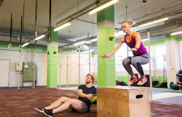 Stock photo: woman and man with medicine ball exercising in gym