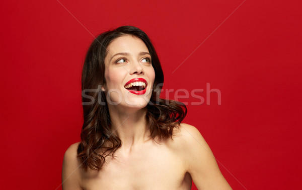 beautiful smiling young woman with red lipstick Stock photo © dolgachov