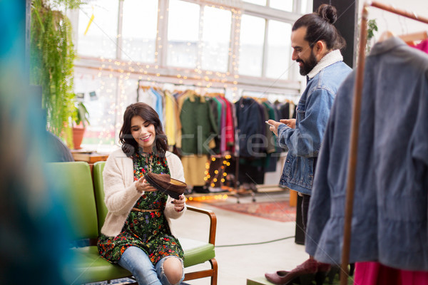 couple choosing footwear at vintage clothing store Stock photo © dolgachov