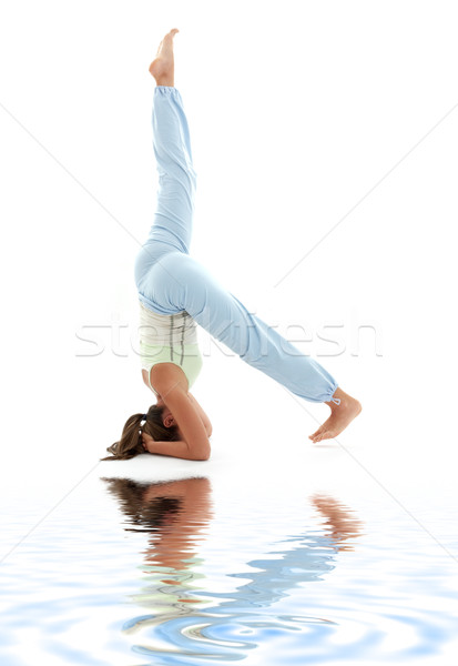 salamba sirsasana supported headstand on white sand #3 Stock photo © dolgachov