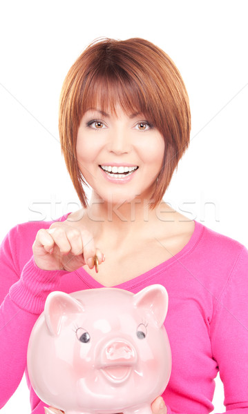 Stock photo: lovely woman with piggy bank and money