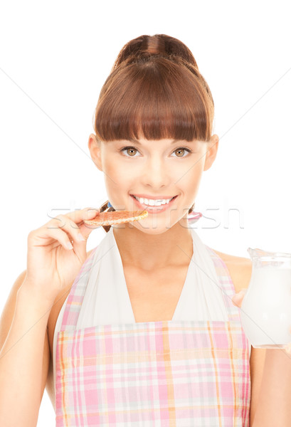 housewife with milk and cookies Stock photo © dolgachov