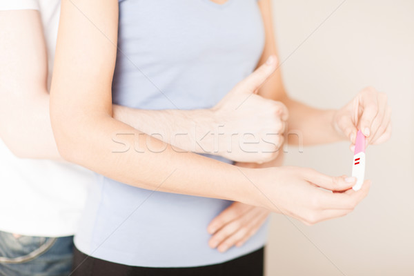 woman and man hands with pregnancy test Stock photo © dolgachov