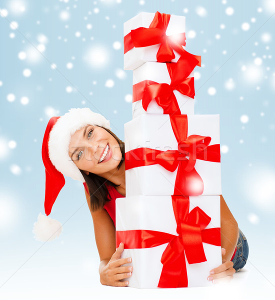 smiling woman in santa helper hat with gift boxes Stock photo © dolgachov