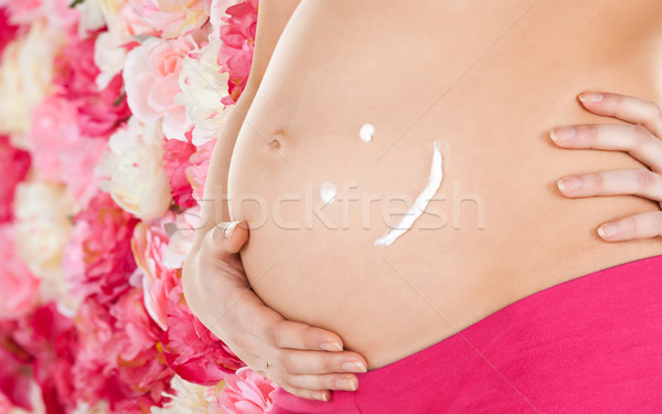 belly of a pregnant woman Stock photo © dolgachov