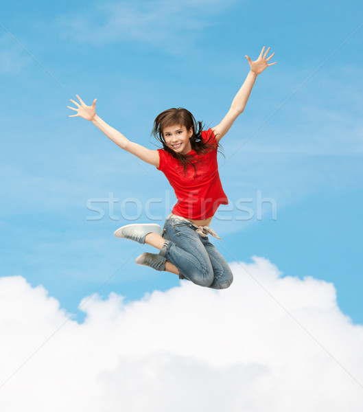 smiling girl jumping Stock photo © dolgachov