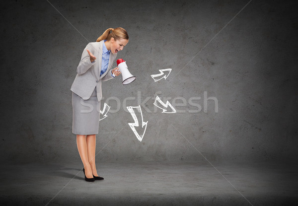 angry businesswoman with megaphone Stock photo © dolgachov