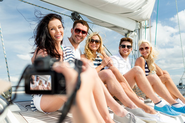 Souriant amis yacht vacances Voyage [[stock_photo]] © dolgachov