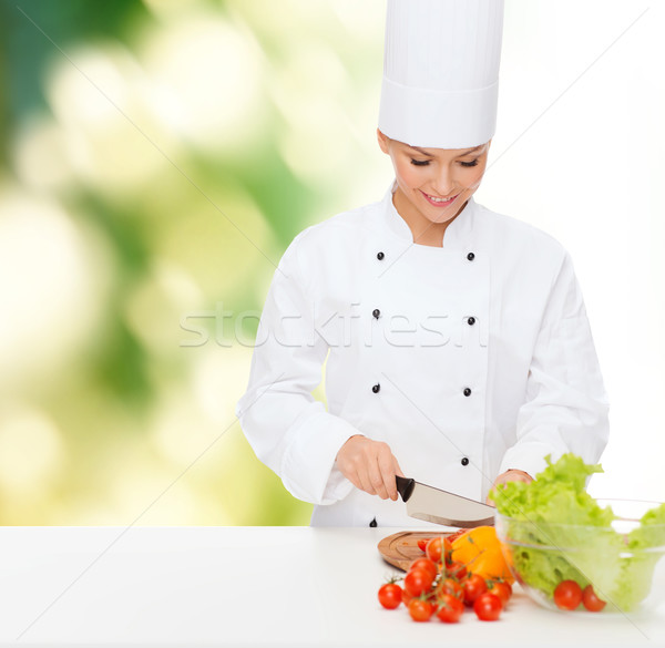 ストックフォト: 笑みを浮かべて · 女性 · シェフ · 野菜 · 料理