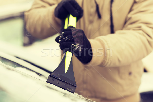 closeup of man scraping ice from car Stock photo © dolgachov