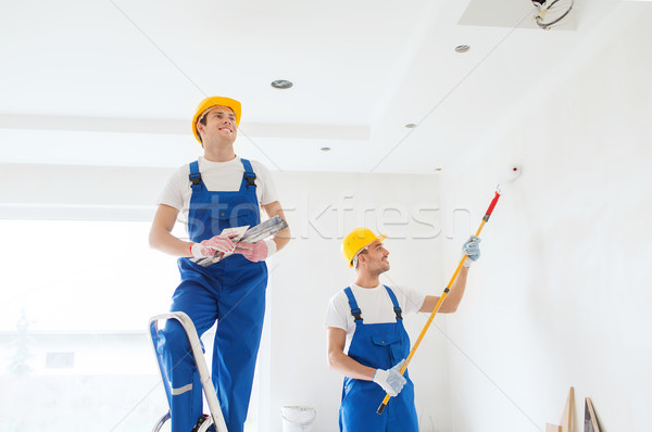 group of builders with tools indoors Stock photo © dolgachov