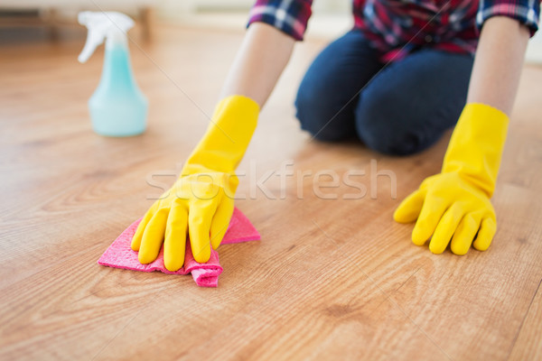 close up of woman with rag cleaning floor at home Stock photo © dolgachov