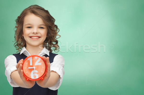 Stock photo: happy girl with alarm clock 