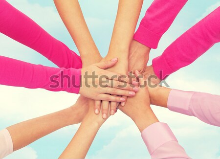 close up of women with hands on top over rainbow Stock photo © dolgachov