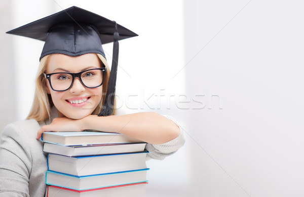 student in graduation cap Stock photo © dolgachov