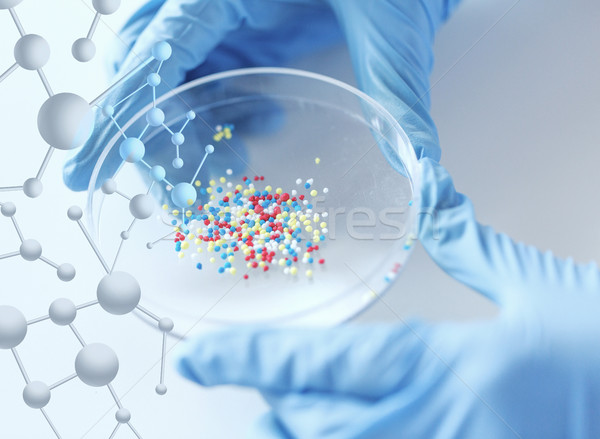 close up of scientist hands holding chemical cure Stock photo © dolgachov